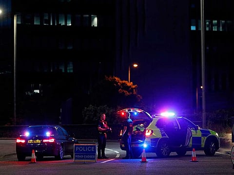 Police secure a cordon near Forbury Gardens park in Reading, west of London, on June 20, 2020 following a stabbing incident.