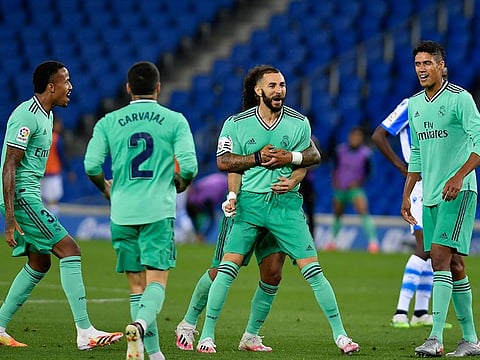 Real Madrid's Karim Benzema celebrates his goal against Real Sociedad.
