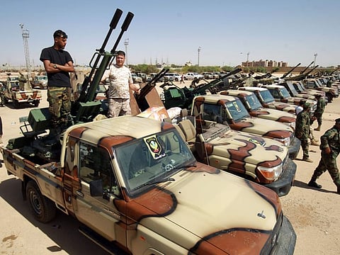 Members of the Libyan National Army (LNA) special forces gather in the city of Benghazi, on their way to reportedly back up fellow LNA fighters on the frontline west of the city of Sirte, facing forces loyal to the Government of National Accord, on June 18, 2020.