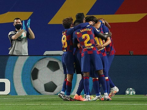 Barcelona's Ivan Rakitic celebrates scoring their first goal with teammates.