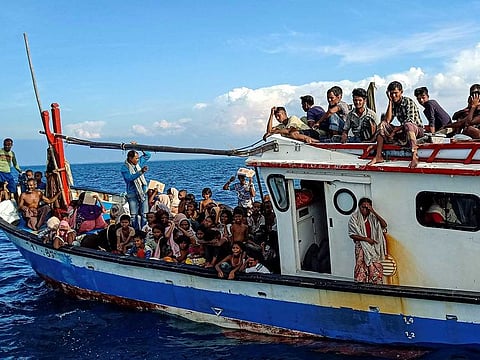 Rohingya refugees are seen on a boat while being rescued by fishermen near the coast of Seunuddon beach in Aceh, Indonesia, June 24, 2020.