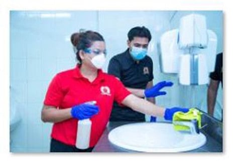 Transguard staff cleaning a public toilet in the UAE