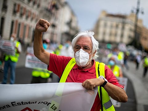 A man gestures during a protest demanding better social conditions in Madrid, Spain.