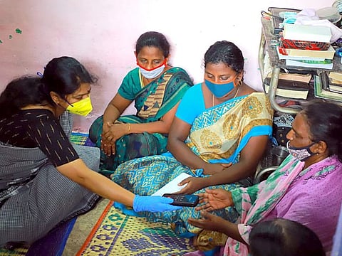 DMK Thoothukudi MP Kanimozhi meeting with kin of the custodial death victim and handing over the compensation of Rs2.5 million in Madurai on Friday.