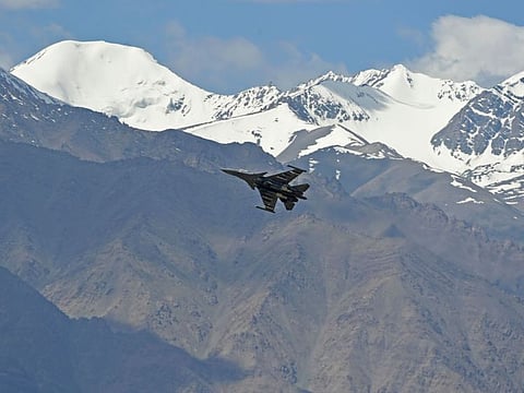 An Indian fighter jet flies over Leh, the joint capital of the union territory of Ladakh, on June 26, 2020. India acknowledged for the first time on June 25 that it has matched China in massing troops at their contested Himalayan border region after a deadly clash this month. But India's foreign ministry accused China of causing the tensions by starting military deployments, and warned relations between the world's two most populous nations could be undermined if the standoff continues.