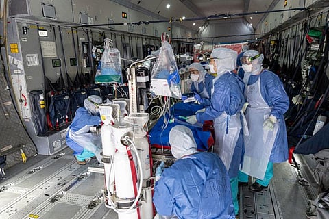 Medical staff check medical equipments installed in an Airbus A400M prior to an evacuation of patients infected with the novel coronavirus (Covid-19) to hospitals of French West Indies, at Guiana air-base 367 in Matoury, near Cayenne, in the French overseas department of Guiana, on June 28.