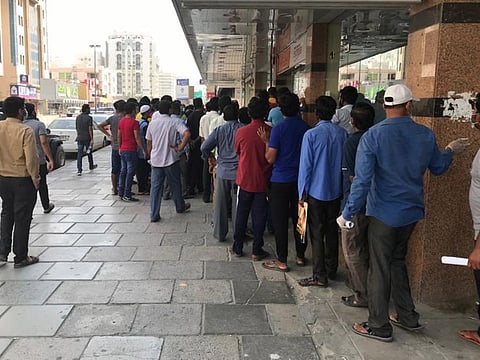 Indians queuing up in front of AIE office in Sharjah.