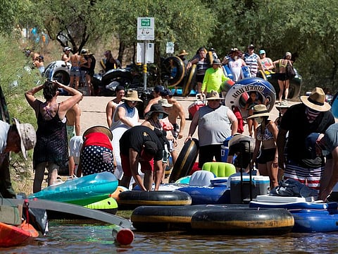 People go tubing on Salt River amid the outbreak of the coronavirus disease (COVID-19) in Arizona, U.S., June 27, 2020.