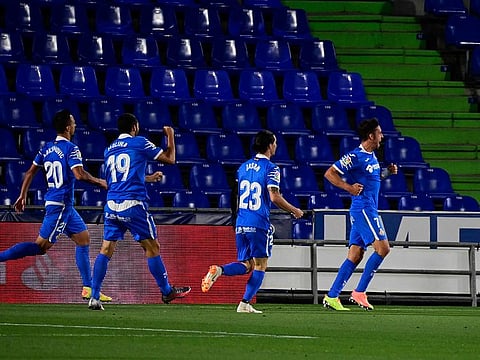 Getafe's Spanish forward Jaime Mata (R) celebrates after scoring.