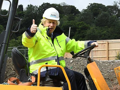 Britain's Prime Minister Boris Johnson visits the Speller Metcalfe's building site at The Dudley Institute of Technology in Dudley