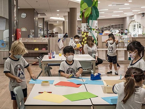 Students and teachers wear face masks and practise social distancing protocols in an effort to prevent spreading the coronavirus, during class at Bangkok Patana School on June 23, 2020.