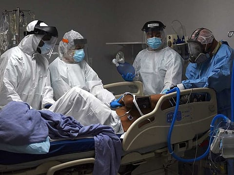 Medical workers prepare to intubate a coronavirus disease (COVID-19) patient at the United Memorial Medical Center's coronavirus disease (COVID-19) intensive care unit in Houston, Texas, U.S..