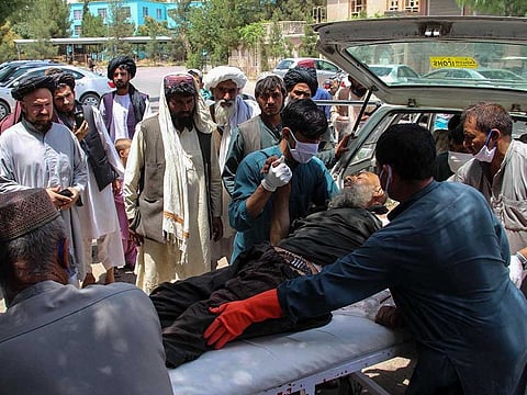 A victim, injured in an explosion at a cattle market in Sangin district, is brought to a hospital in Lashkar Gah city of Helmand province on June 29, 2020. Multiple explosions tore through a busy market in southern Afghanistan on June 29, killing at least 23 civilians, officials said, blaming the Taliban for the carnage.