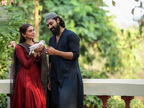 Aditi Rao Hydari and Dev Mohan in 'Sufiyum Sujatayum'.