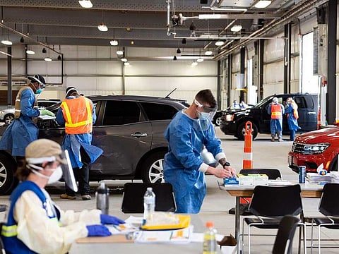 Testing for the coronavirus at a drive-thru site at Alliant Energy Center in Madison, Wisconsin, on Wednesday, July 1, 2020. Coronavirus cases have been rising in the area according to officials.