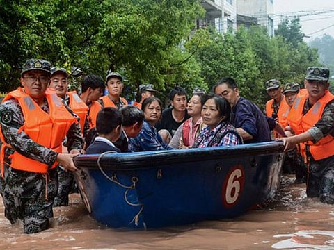 Heavy rains this time of year often swell China's rivers and cause its reservoirs to overflow. This year, however, the battle against the coronavirus pandemic has strained flood preparations