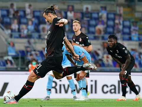 AC Milan's Zlatan Ibrahimovic scores his side's 2nd goal against Lazio