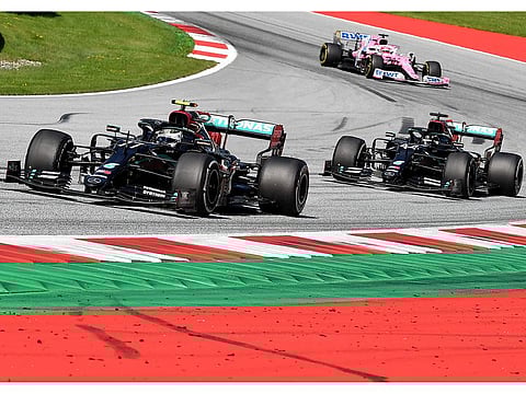 Mercedes' Finnish driver Valtteri Bottas leads Lewis Hamilton during the Austrian Grand Prix