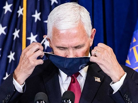 US Vice-President Mike Pence removes his face mask to address members of the Commissioned Corps of the US Public Health Service, at their headquarters in Rockville, Maryland, on June 30, 2020.