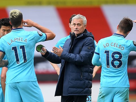 Tottenham Hotspur manager Jose Mourinho with his players.