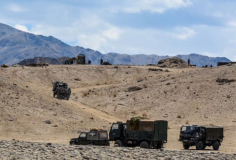 Indian army soldiers drive vehicles along mountainous roads as they take part in a military exercise at Thikse in Leh district of the union territory of Ladakh on July 4, 2020.