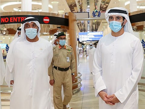 Sheikh Hamdan bin Mohammad bin Rashid Al Maktoum (right) with Sheikh Ahmed bin Saeed Al Maktoum at Dubai International airport