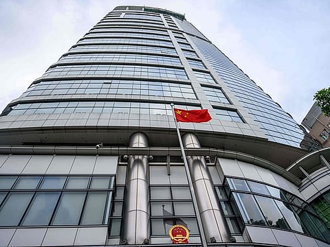 A Chinese flag flutters outside the Office for Safeguarding National Security of the Central People's Government in the Hong Kong Special Administrative Region after its official inauguration in Hong Kong on July 8, 2020.
