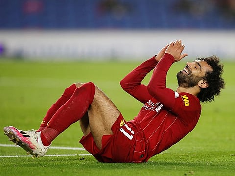 Liverpool's Mohamed Salah reacts after missing a hat-trick chance.