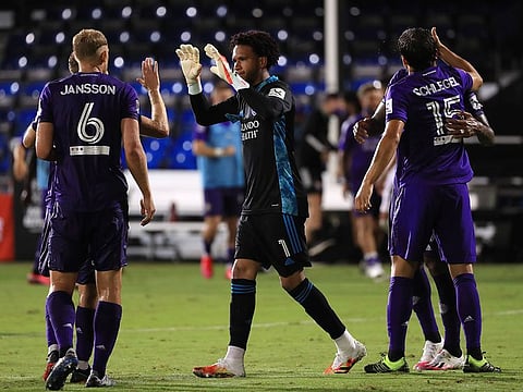 Pedro Gallese of Orlando City greets teammates after their victory over Inter Miami