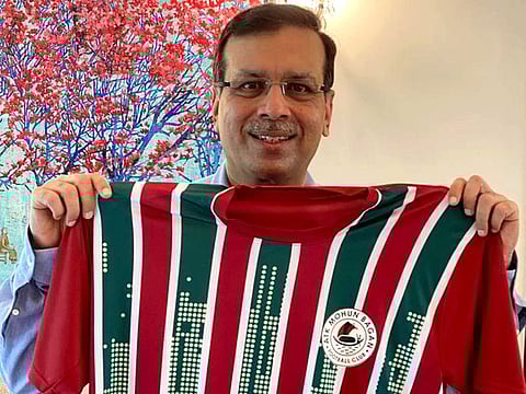 Sanjeev Goenka, principal owner of ATK Mohun Bagan, shows off the new jersey of the club after their board meeting on Friday.