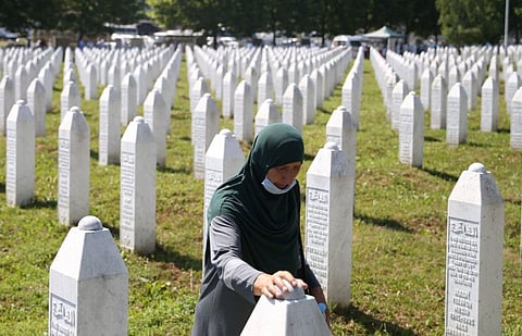 A woman is seen at a graveyard, ahead of a mass funeral in Potocari near Srebrenica, Bosnia and Herzegovina July 11, 2020.