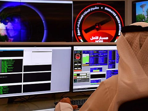 An employee works at the control room of the Mars Mission at the Mohammed Bin Rashid Space Centre (MBRSC) in Dubai