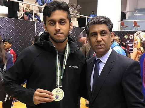 President Pakistan Taekwondo Federation (PTF) Colonel (retired) Waseem Ahmed Janjua (left) with UAE-based Pakistani Taekwondo player Ammar Ahmed after he won gold medal in Islamabad last year.