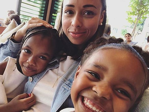 Dunya Al Hashar and her daughters