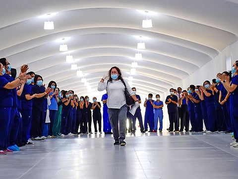 Paramedics cheer as final Covid-19 patients being discharged from Dubai Parks & Resorts Field Hospital, a 1,200-bed facility managed by Abu Dhabi Health Services Company (SEHA) on Monday 13 July 2020. Photo: Virendra Saklani/Gulf News