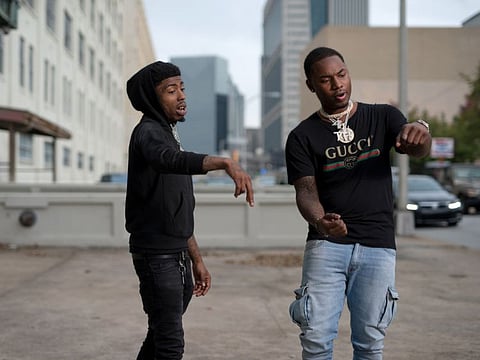 Rappers Loso Loaded, left, and Marlo during a video shoot in Atlanta, November 1, 2017.