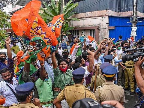 BJP workers during a protest against Swapna Suresh and Sandeep Nair, accused in Kerala gold smuggling case, in Kochi, Sunday, July 12, 2020.