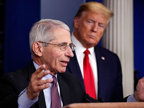 In this April 22, 2020 file photo, President Donald Trump watches as Dr. Anthony Fauci, director of the National Institute of Allergy and Infectious Diseases, speaks about the coronavirus in the James Brady Press Briefing Room of the White House in Washington.