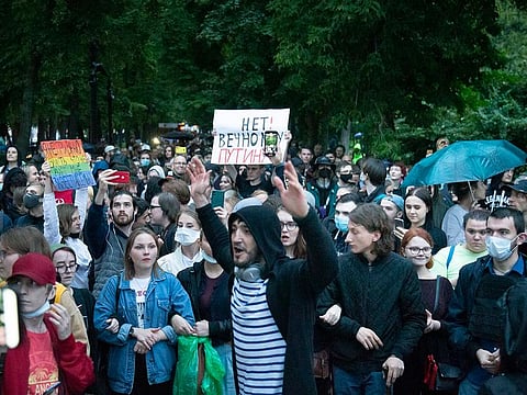 Protesters with a poster reading "no to eternal Putin!" shout during a rally to cancel the results of voting on amendments to the Constitution in Moscow, Russia, Wednesday, July 15, 2020.