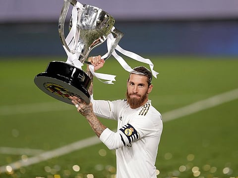 Real Madrid's captain Sergio Ramos lifts the La Liga trophy.