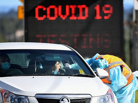 A member of the public is seen getting a test for the coronavirus disease (COVID-19) at the Crossroads Hotel testing centre following a cluster of infections in Sydney, Australia, July 16, 2020.
