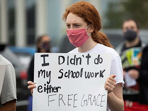 Students protest in support of a Black Groves High School student, who was jailed due to a probation violation of not keeping up with her online schoolwork, in front of the Oakland County Circuit Court and Prosecutors Office in the Detroit suburb of Pontiac, Michigan, U.S. July 16, 2020.