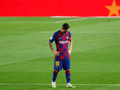 Barcelona's Lionel Messi dejected as walks after the end of the loss to Osasuna