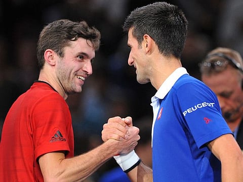Gilles Simon with Novak Djokovic