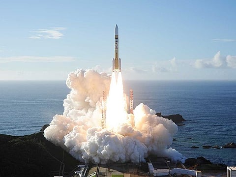 An H-2A rocket carrying the Hope Probe lifts off from the launching pad at Tanegashima Space Center on the island of Tanegashima, Japan