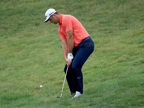 Jon Rahm chips in for birdie on the 16th hole during the final round of The Memorial Tournament at Muirfield Village Golf Club in Dublin, Ohio