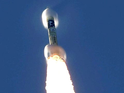 An H-2A rocket carrying the Hope Probe rises into the air after blasting off from the launching pad at Tanegashima Space Center on the southwestern island of Tanegashima, Japan