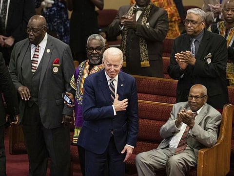 Democratic presidential candidate former Vice-President Joe Biden acknowledges applause from parishioners as he departs after attending services, Sunday, Feb. 23, 2020, at the Royal Missionary Baptist Church in North Charleston, S.C.