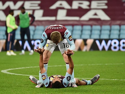 Aston Villa's Trezeguet and Matt Targett celebrate after the match.