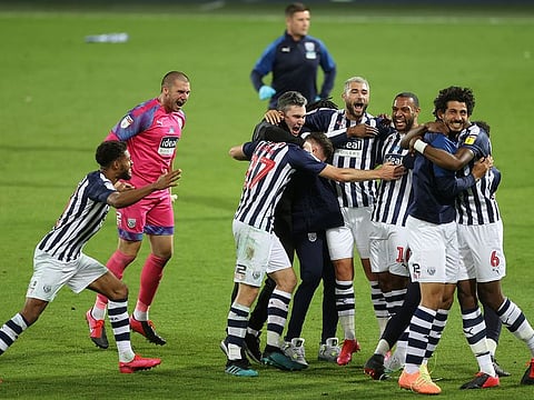 West Bromwich Albion players celebrate promotion to the Premier League.